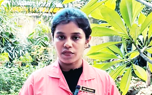 A patient in an Abha Surgy Centre gown speaking to camera in the centre's garden